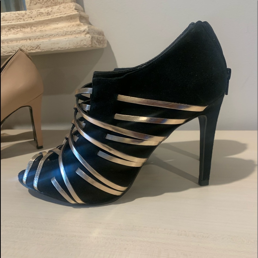 Black sued and gold leather heel 4” From Brazil . Unique and just used one time